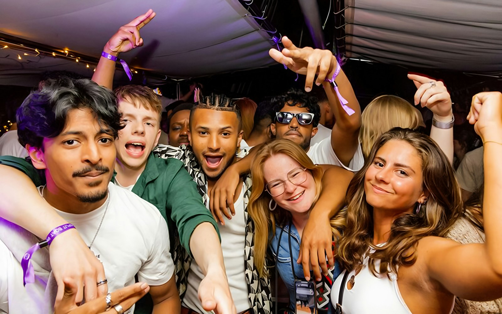 Group of friends enjoying a lively boat crawl in Split, Croatia.