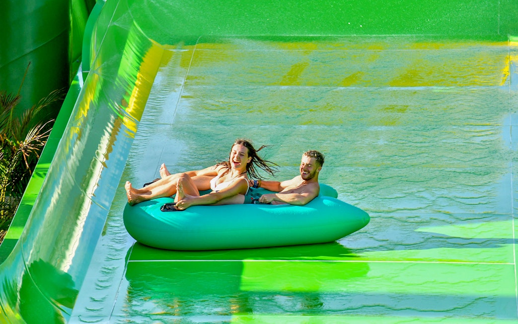Couple on a tube sliding down at Waterbom Bali.