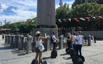 Tourists on Segways near the Obelisk of Theodosius in Istanbul.