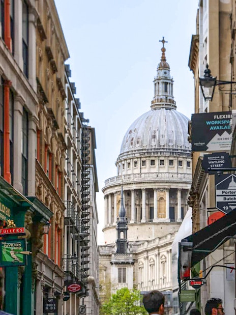Narrow London street with view of St. Paul's Cathedral dome, part of Eating London food tour.