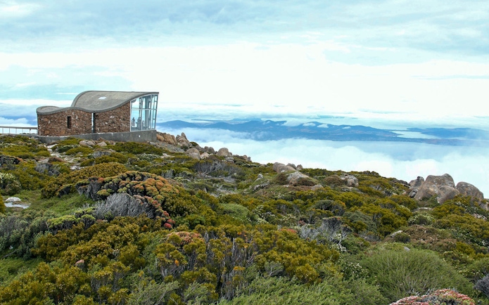 kunanyi Mt Wellington summit view with observation shelter and distant landscape.