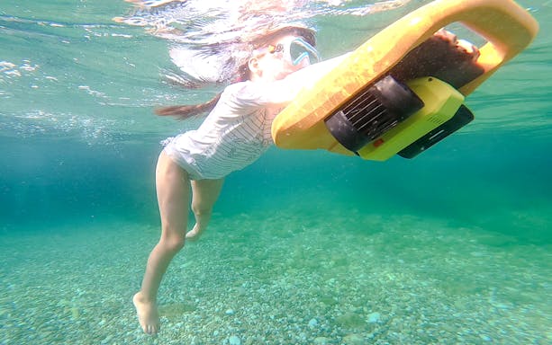 Person using underwater scooter in Nice, France.