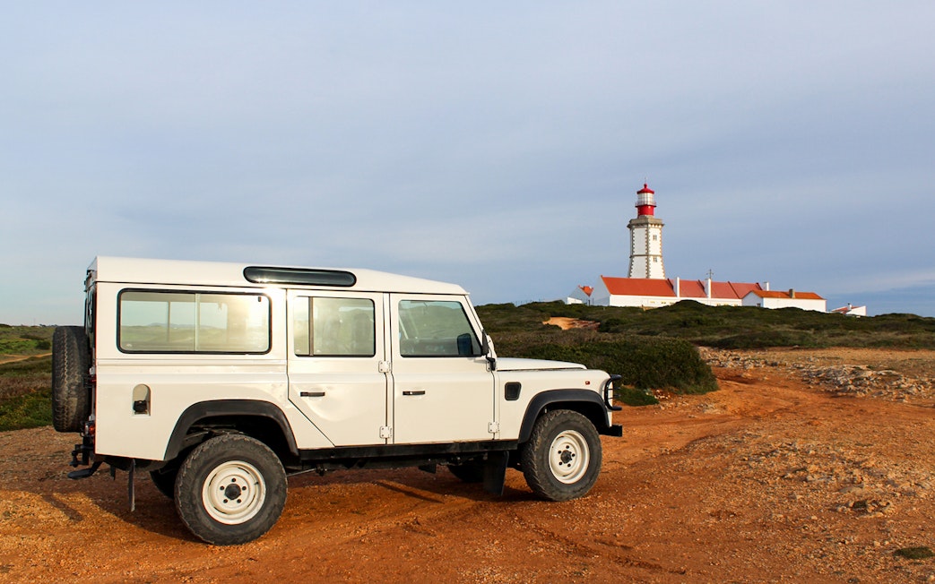 4x4 Jeep near Cape Espichel lighthouse on guided tour, Sesimbra, Portugal.