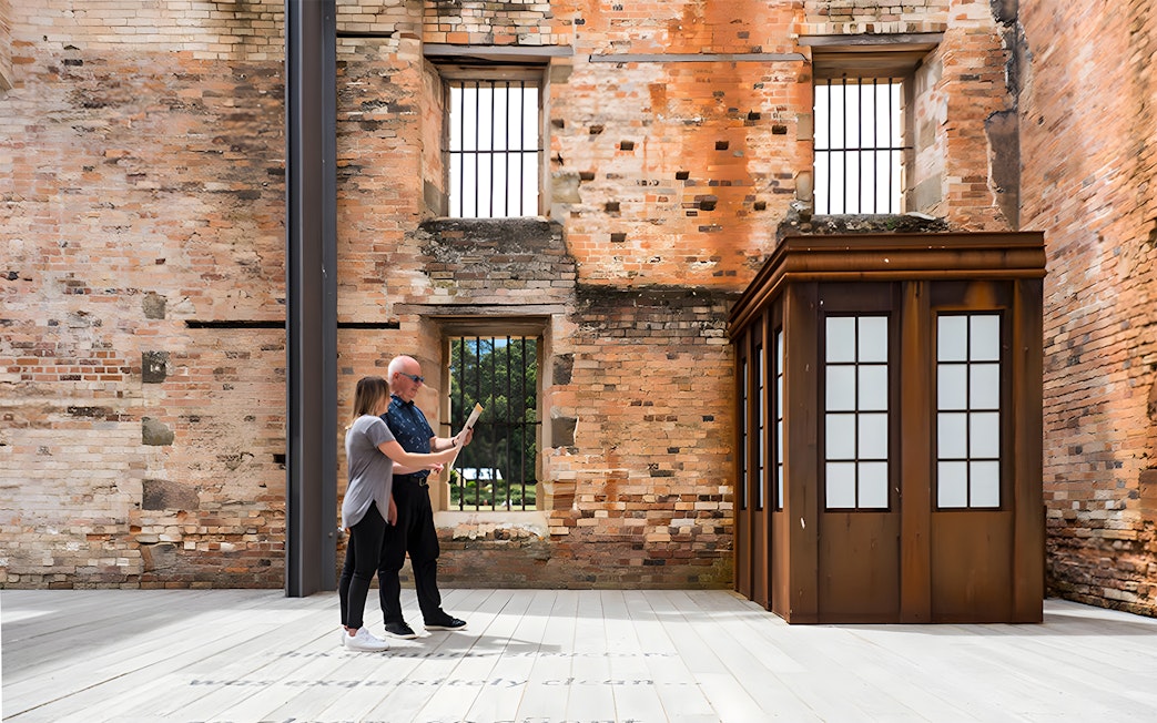 Visitors exploring historic ruins at Port Arthur, Tasmania.