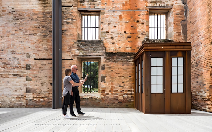 Visitors exploring historic ruins at Port Arthur, Tasmania.