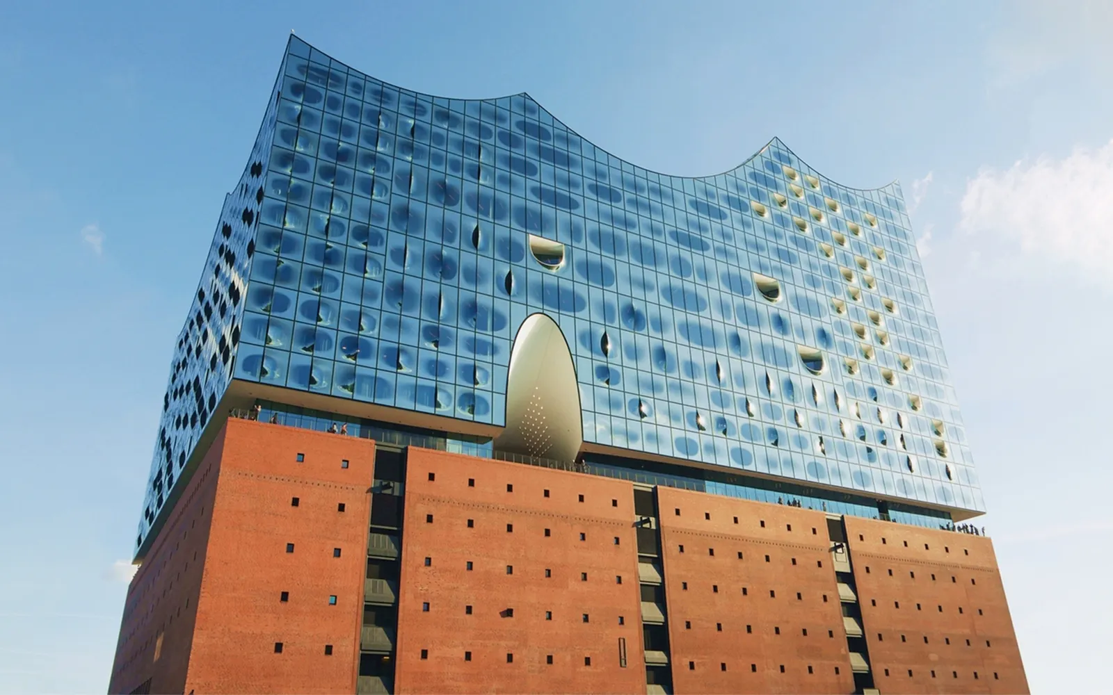 Elbphilharmonie Hamburg exterior with glass facade and brick base.
