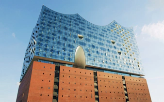 Elbphilharmonie Hamburg exterior with glass facade and brick base.