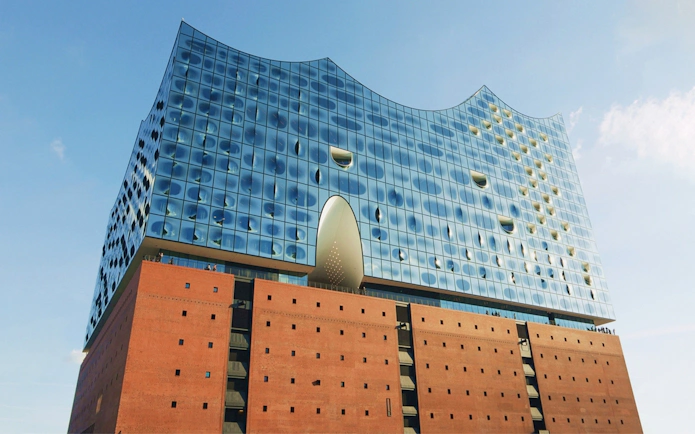 Elbphilharmonie Hamburg exterior with glass facade and brick base.