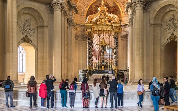 Visitors viewing Napoleon's Tomb at the Invalides, Paris Army Museum.