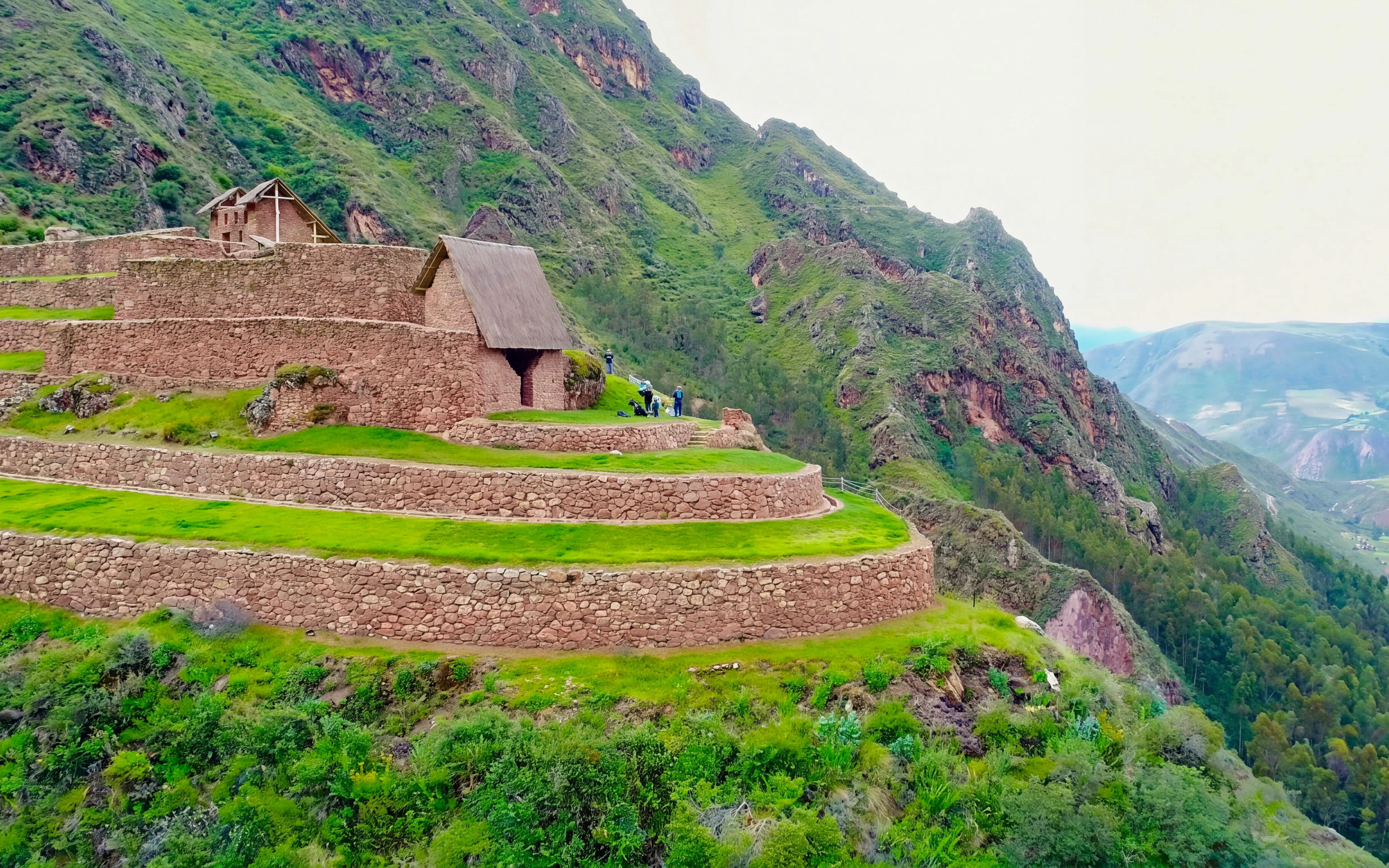 Terraced stone structures at Raqaypata above the Sacred Valley near Perolniyoc waterfall, Peru.