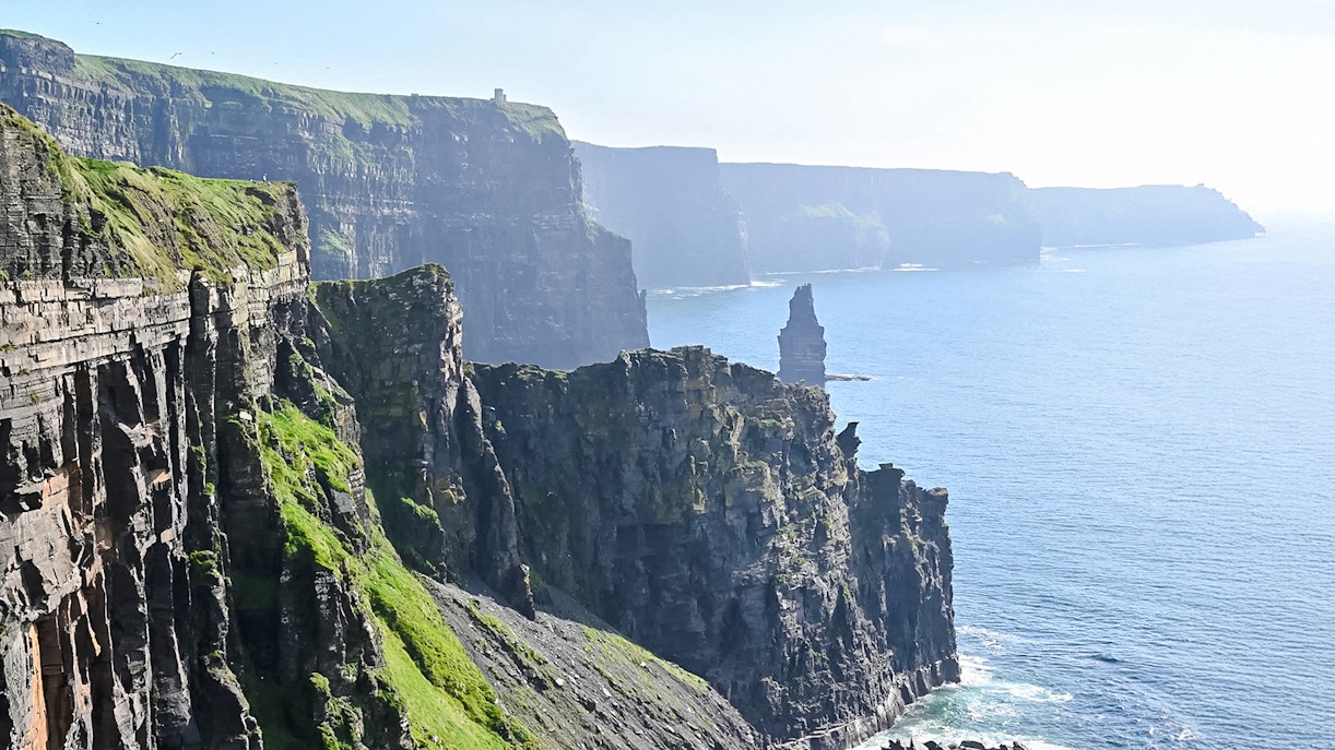 Cliffs of Moher, Ireland, with rugged cliffs and ocean view.