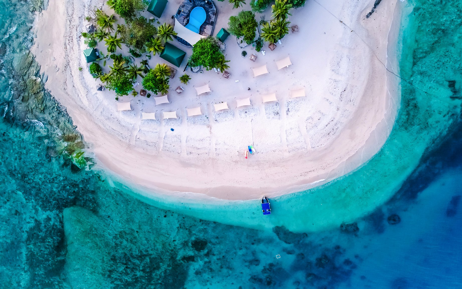 Aerial view of South Sea Island, Fiji with sandy beach and turquoise waters.