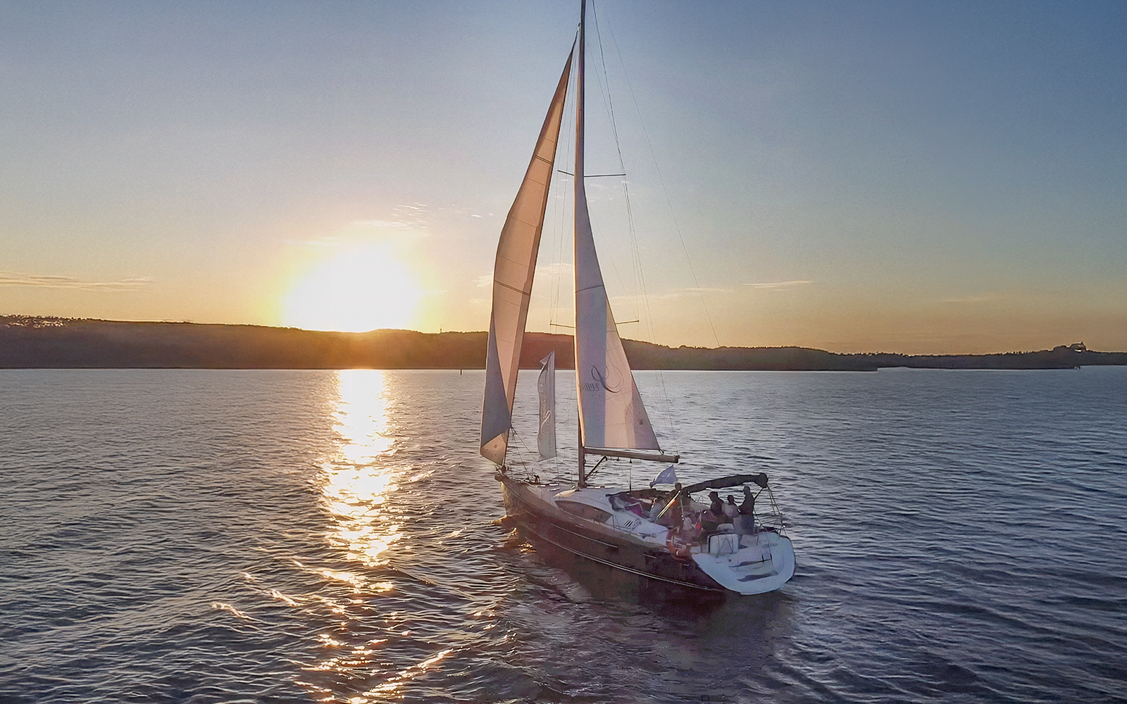 Sailing boat at sunset on a cruise from Sopot Pier, Gdansk.