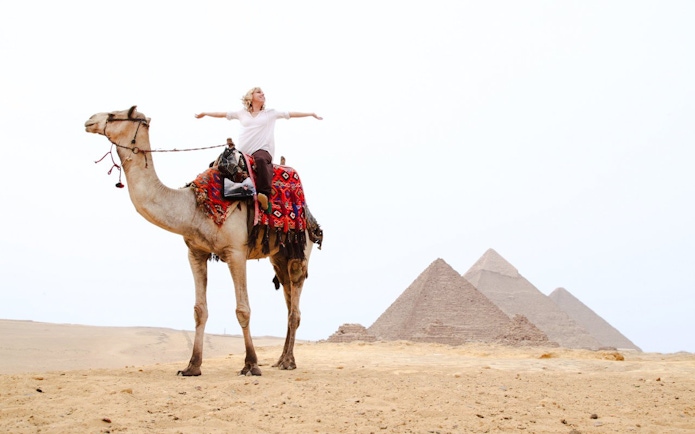 Camel ride near the Pyramids of Giza, Egypt.