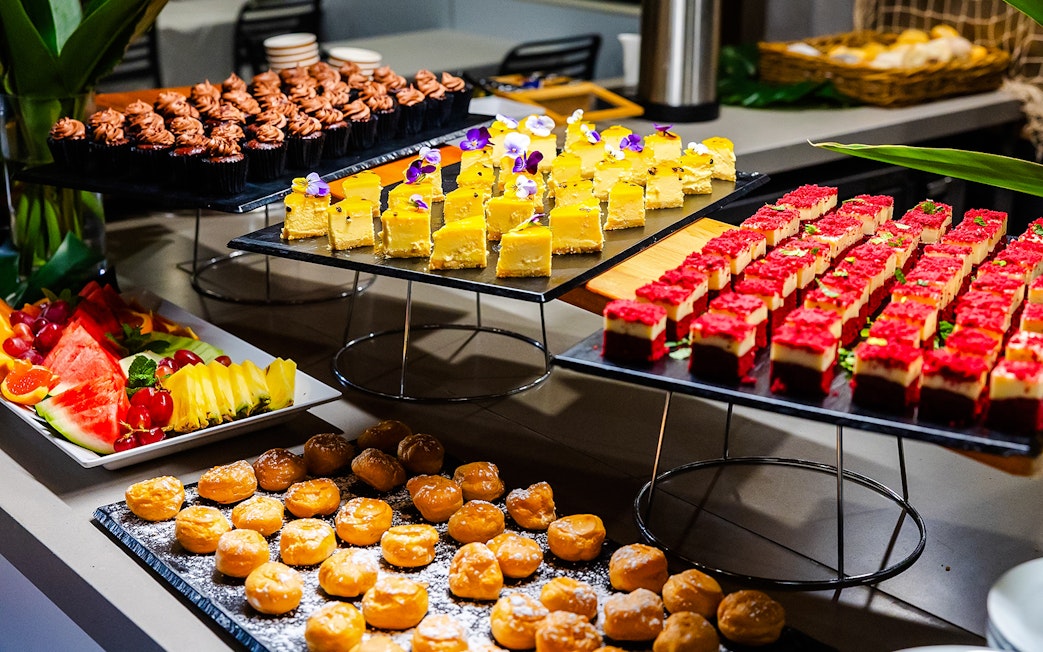 Buffet spread with desserts and fruit on Gold Coast sightseeing cruise.