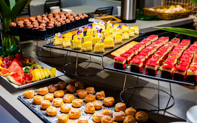 Buffet spread with desserts and fruit on Gold Coast sightseeing cruise.
