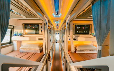 Sleeper cabin interior of shared shuttle for Sapa–Hanoi–Noi Bai Airport transfer.