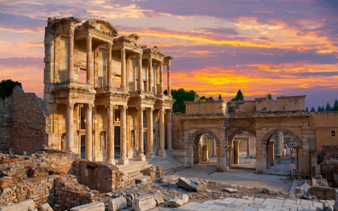 Ancient ruins of the Library of Celsus in Ephesus at sunset, part of the Ephesus & Pamukkale tour.