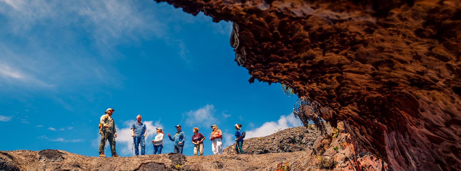 Guests exploring volcanic terrain on Hawaii adventure tour.