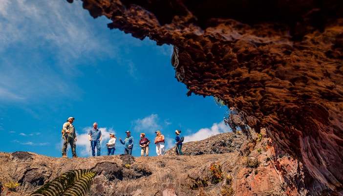 Guests exploring volcanic terrain on Hawaii adventure tour.
