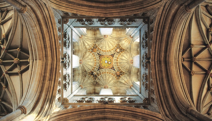 Intricate ceiling view of Bell Harry Tower in Canterbury Cathedral, England.