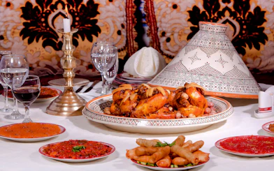 Moroccan feast with tagine and appetizers at Dar Essalam Dinner Show.