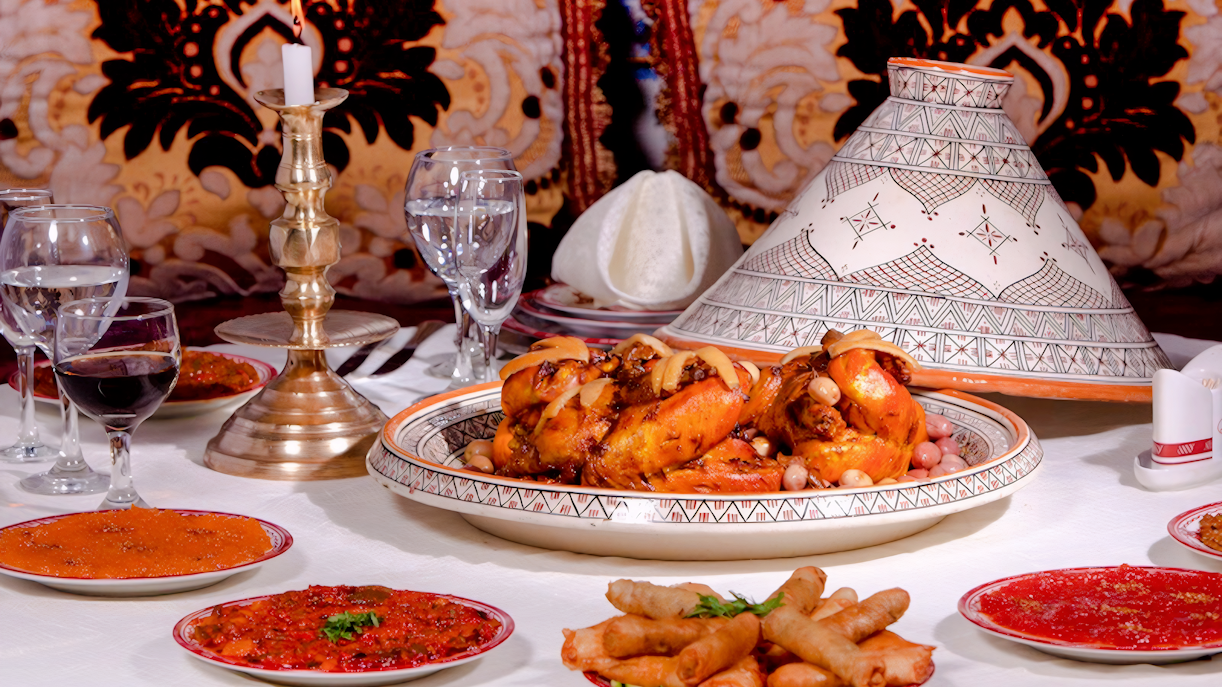 Moroccan feast with tagine and appetizers at Dar Essalam Dinner Show.