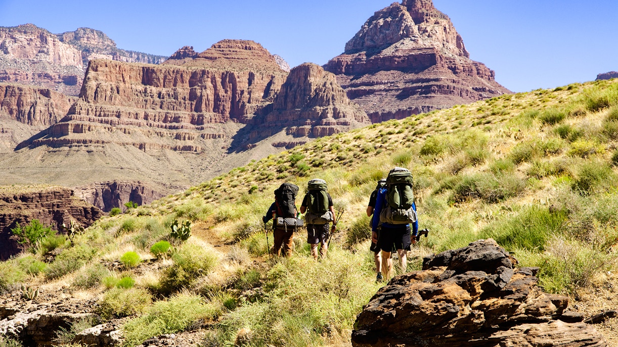 Hikers on Grandview Trail approaching Colorado River in Grand Canyon.