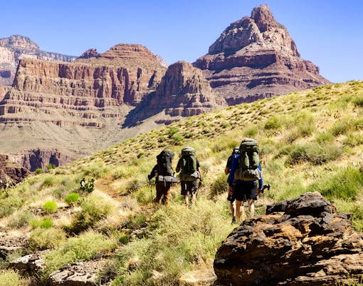 Hikers on Grandview Trail approaching Colorado River in Grand Canyon.