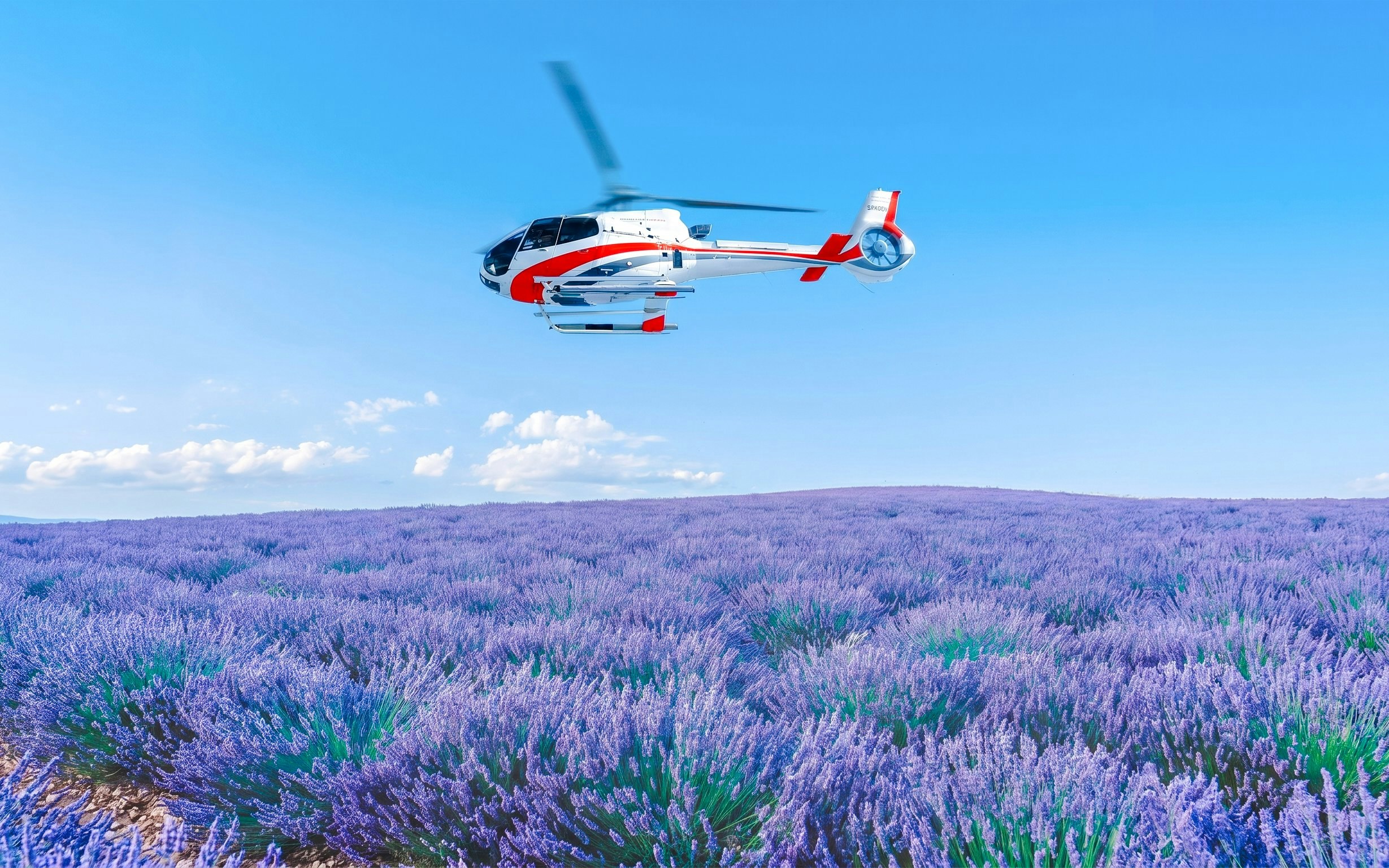 Helicopter flying over lavender fields in Monaco.