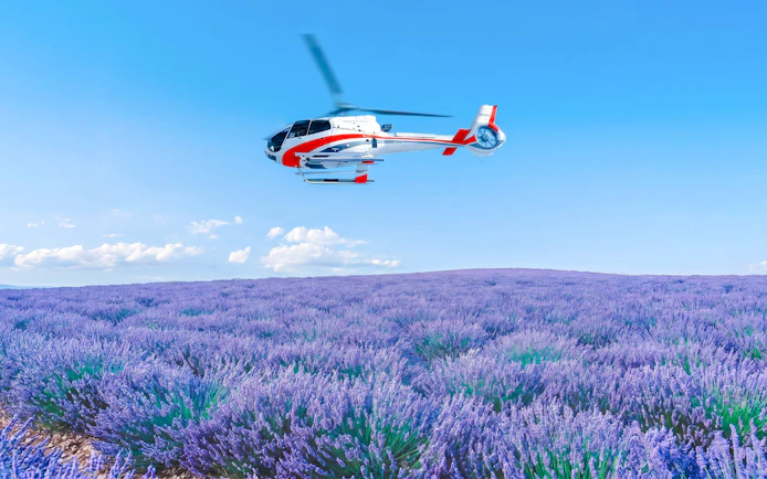Helicopter flying over lavender fields in Monaco.