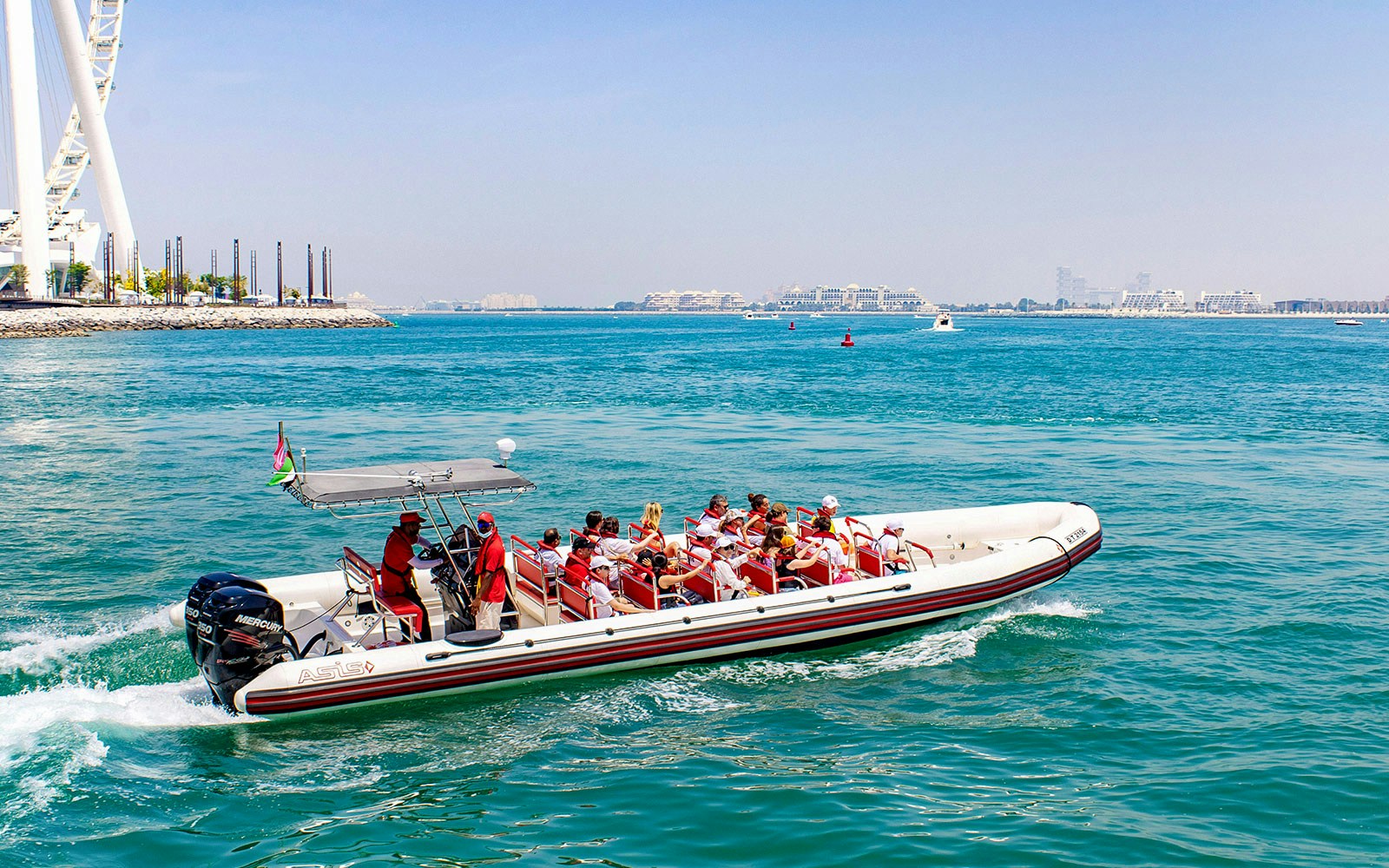 Speedboat cruising past Dubai Marina with views of Atlantis, Palm Jumeirah, and Burj Al Arab.