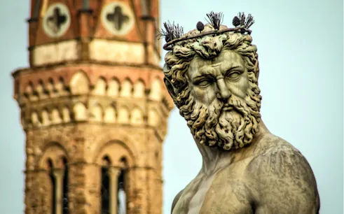 Statue of Neptune with Florence's Palazzo Vecchio tower in the background.