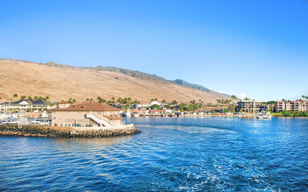 Panoramic view of Ma'alaea Harbor with buildings and mountains, Maui, Hawaii.