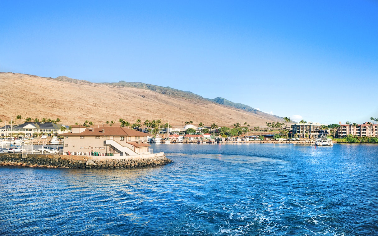 Panoramic view of Ma'alaea Harbor with buildings and mountains, Maui, Hawaii.