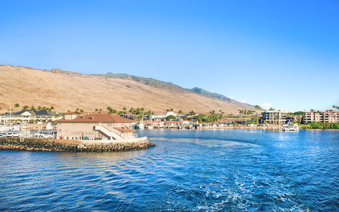 Panoramic view of Ma'alaea Harbor with buildings and mountains, Maui, Hawaii.