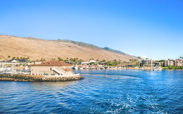 Panoramic view of Ma'alaea Harbor with buildings and mountains, Maui, Hawaii.