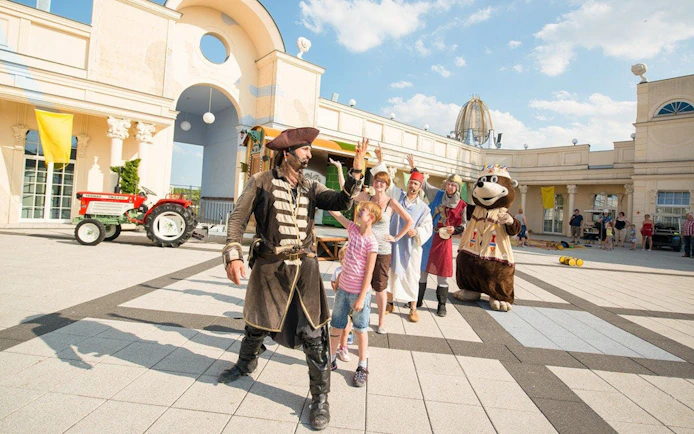 Guests interacting with performers at BELANTIS Adventure Park.