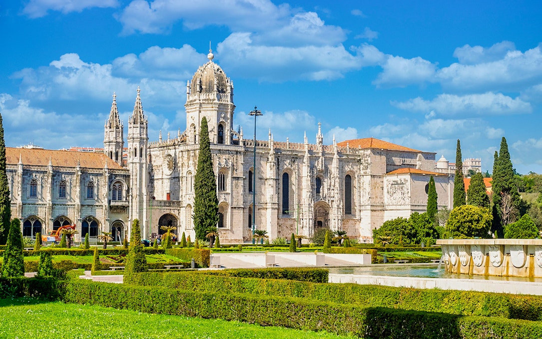 Jernimos Monastery front view with gardens in Lisbon, Portugal.
