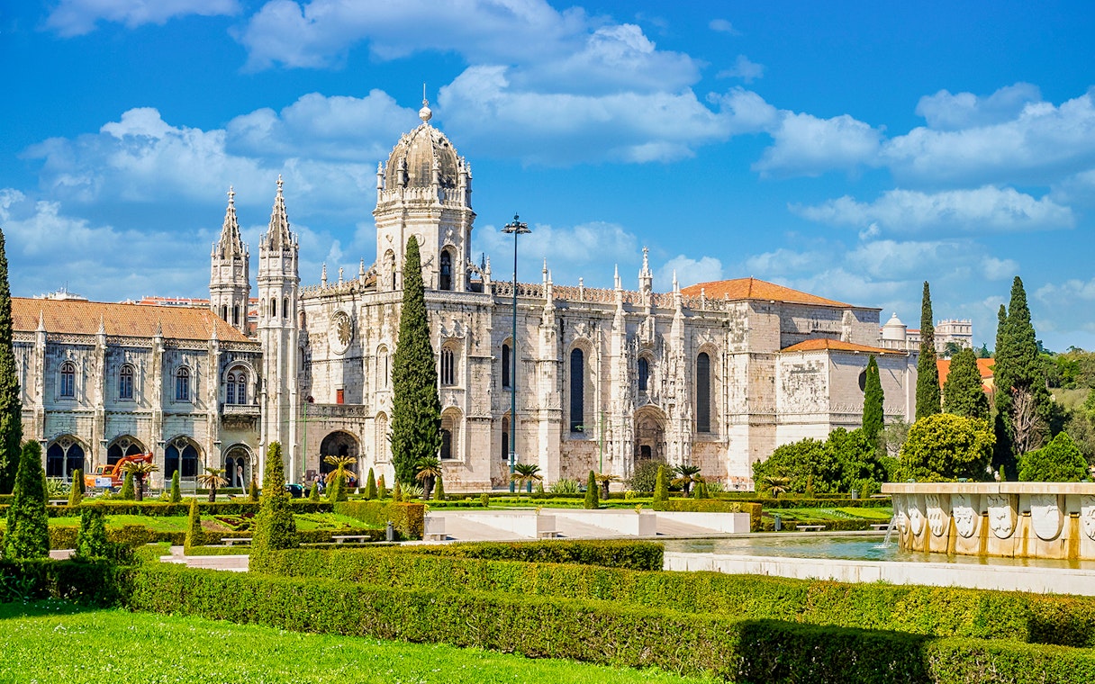 Jernimos Monastery front view with gardens in Lisbon, Portugal.