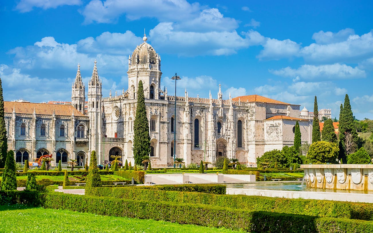 Jernimos Monastery front view with gardens in Lisbon, Portugal.