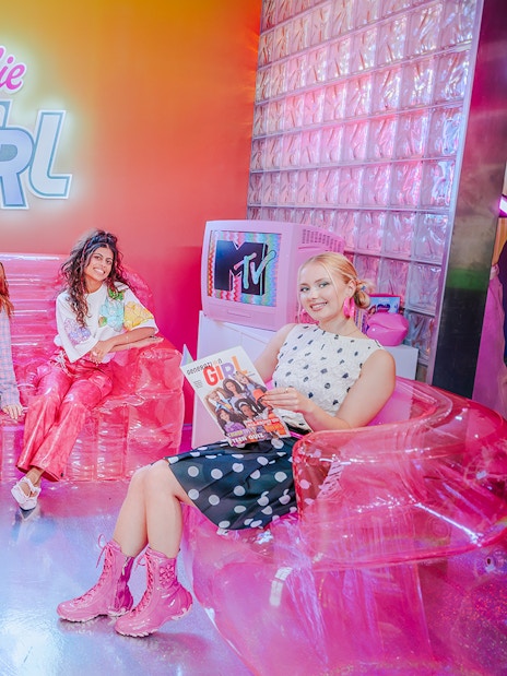 Guests enjoying the Barbie Generation Girls set with vibrant decor and retro elements.