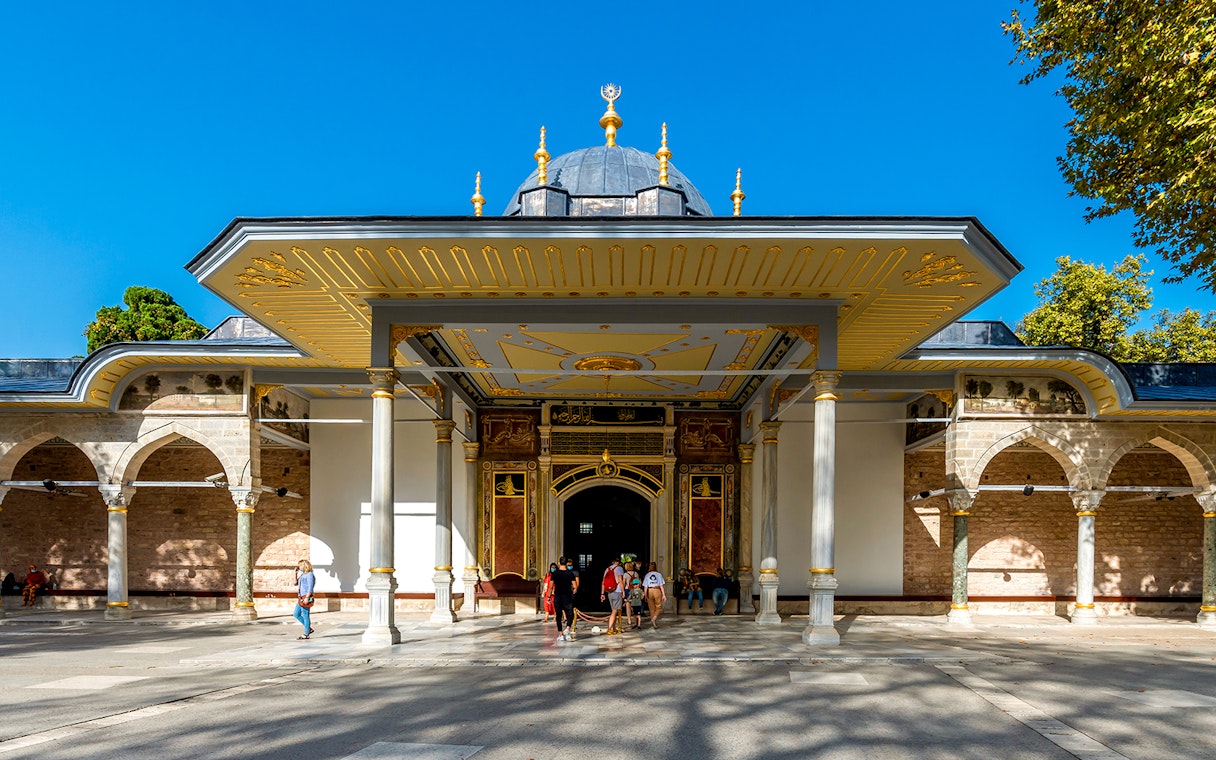 Gate of Felicity at Topkapi Palace, Istanbul, with visitors exploring the historic entrance.