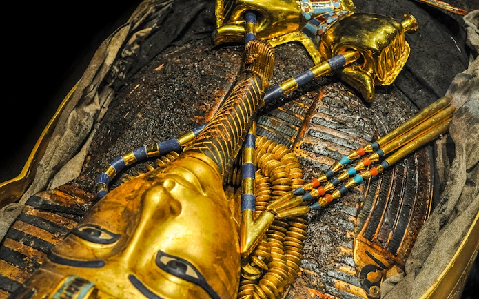 Golden mask of a pharaoh in the Tomb of the Pharaoh, Cairns exhibit.