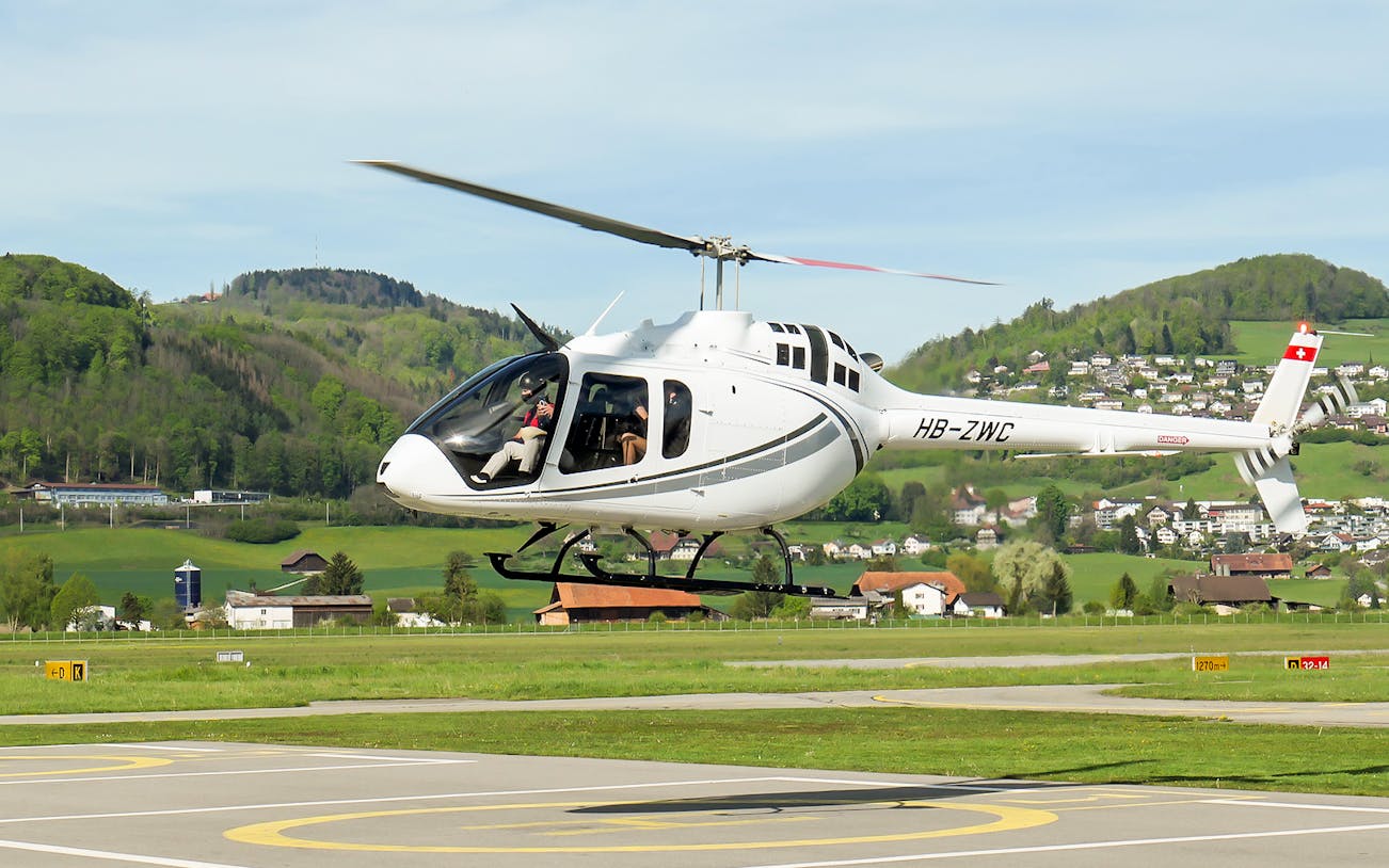 Helicopter taking off for a scenic flight over the Swiss capital city.