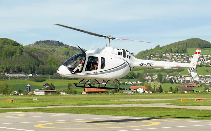 Helicopter taking off for a scenic flight over the Swiss capital city.