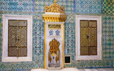 Topkapi Palace Harem fountain with intricate tile patterns and ornate gold details.