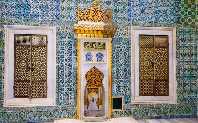 Topkapi Palace Harem fountain with intricate tile patterns and ornate gold details.