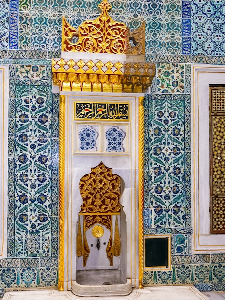 Topkapi Palace Harem fountain with intricate tile patterns and ornate gold details.