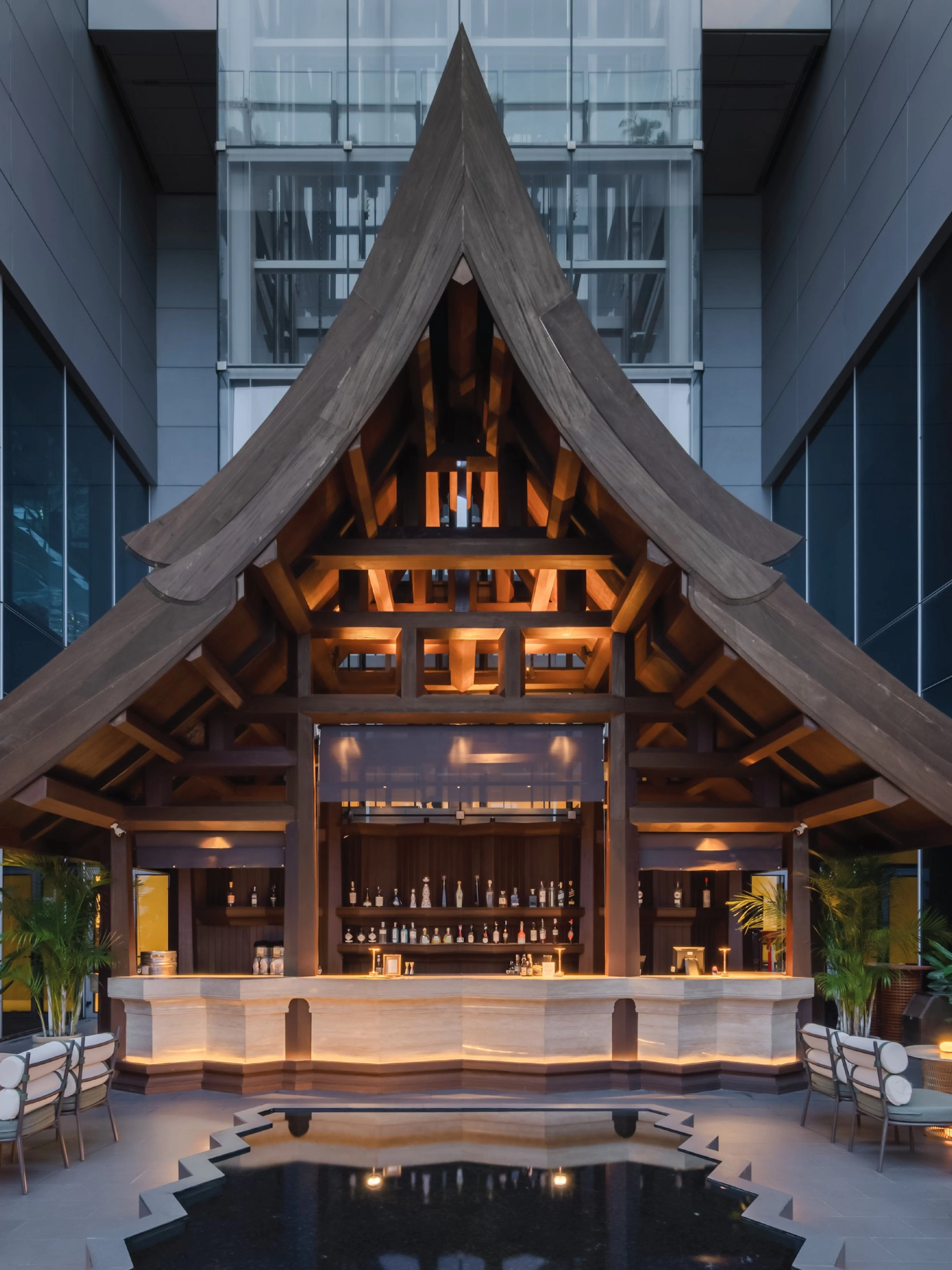 Rooftop bar with wooden architecture at Akara Sky Hanuman, One City Centre, Bangkok.